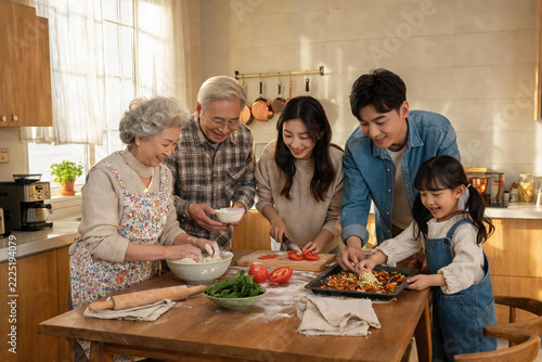 Multigenerational Asian Family Preparing Homemade Meal Together in Kitchen