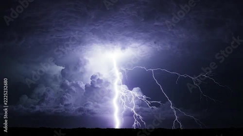 Powerful Lightning Strikes Illuminate Dark Night Sky During Thunderstorm.