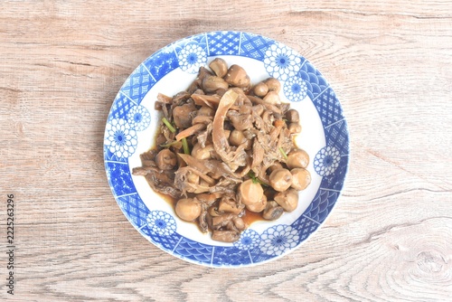fried slice oyster and straw mushroom with soy sauce vegetarian food on plate