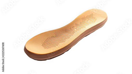 Tan foam shoe insole with a perforated surface texture on white background