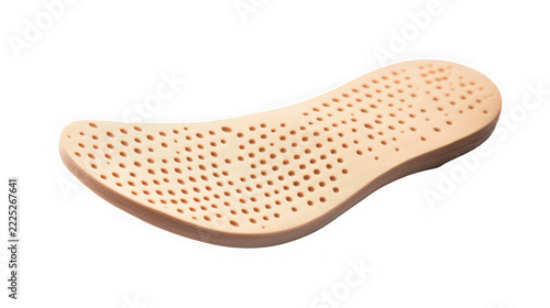 A single beige foam shoe insole with ventilation holes on white background