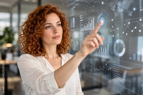 Woman Touching a Translucent Analytical Interface with Graphs and Connected N...