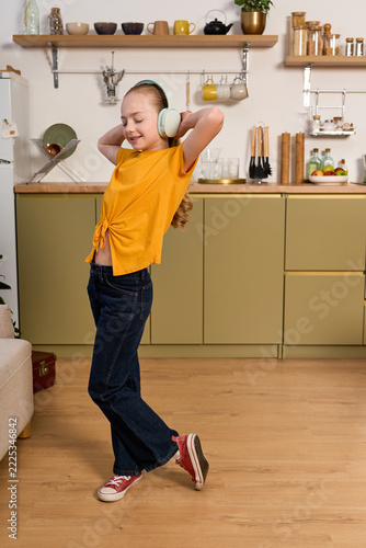 Cute preteen girl spending joyful weekend moments in a cozy home