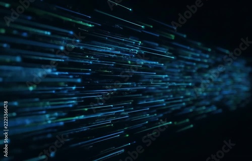 Dynamic blue and green light streaks flowing rapidly, representing data.