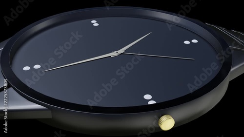 Wide close up of a navy blue watch dial with a ticking second hand and gold crown on black background