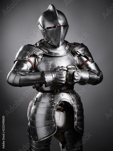 realistic portrayal of a medieval knight in shining plate armor, including detailed craftsmanship. An impressive reflection of historical military costumes, strength, and medieval warfare aesthetics.