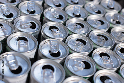 Numerous open aluminium cans from above