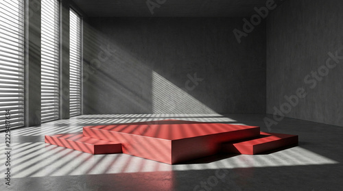 Front view of a minimalist charcoal grey empty studio interior with a dramatic red geometric stage, featuring stark slatted blind shadows.