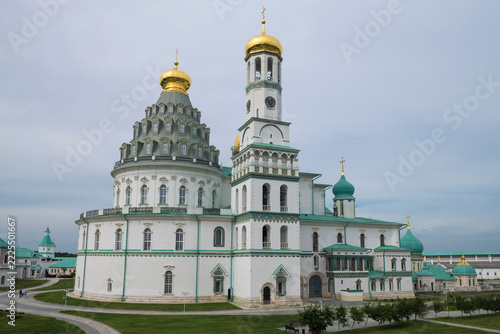 Wall Mural Cathedral of the Resurrection of Christ with a bell tower on a cloudy July day