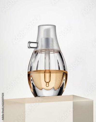 Minimalist Skincare Serum Packaging with Soft Curves and Golden Liquid