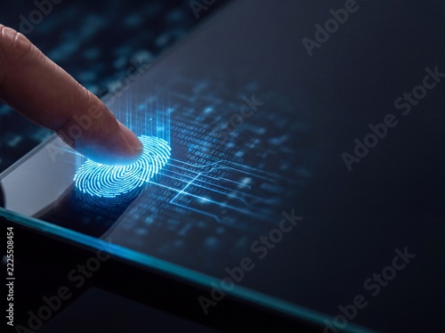 Finger touching a digital fingerprint scanner