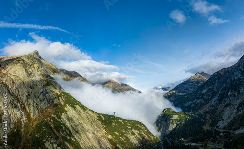 Mountain Peaks Piercing the Clouds at Grimsel Pass, Switzerland