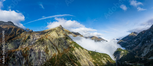 Mountain Peaks Piercing the Clouds at Grimsel Pass, Switzerland