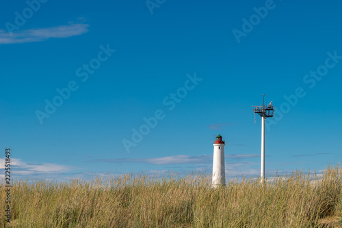 Finland. Marjaniemi Lighthouse, built in 1871 on the island of Hailuoto near the city of Oulu. A modern marine navigation radar system is located nearby.