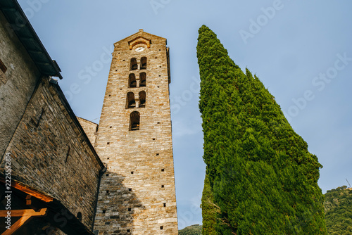 Romanesque Church of Saint-Martin d'Unac with Tall Cypress Tree, Historic Stone Bell Tower, Unac, France