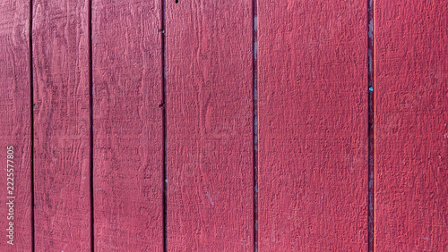 Red painted wooden barn wall planks background