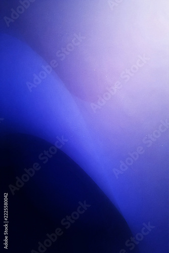 Minimalist abstract background, featuring smooth gradient, transitions from deep, navy blue to, soft lavender and, bright white light