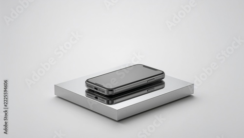 Two cell phones sitting on top of a cardboard box