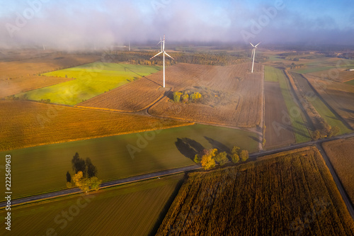 Wind turbines in a rural agricultural landscape during autumn