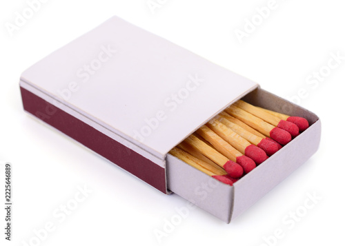 open matchbox with red matches isolated on white background