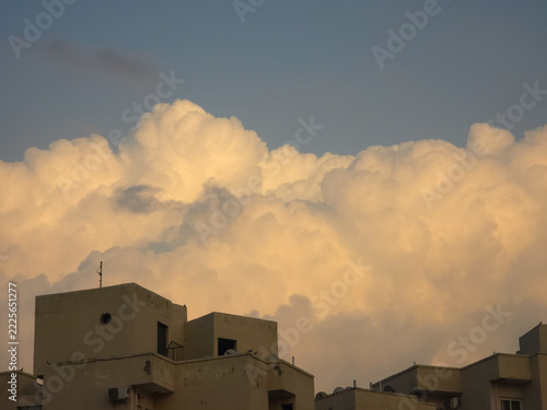 Golden Hour Clouds Over Residential Buildings
