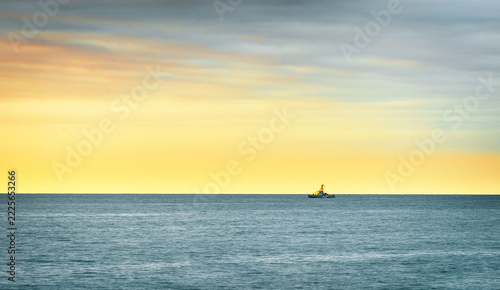 pictorial sunset seascape with a coast guard