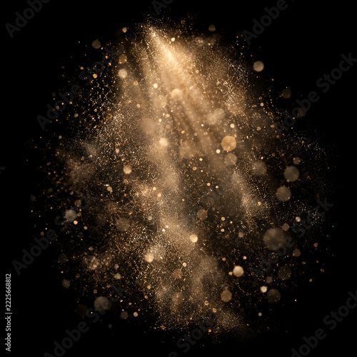 Gold dust golden glitter light burst sparkle glowing particle abstract background magic dark background golden dust glow shimmer light burst