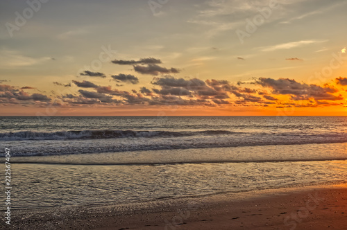 A vast stretch of the beach has settled for the sundown. Playa Harmosa on the Pacific Coast of Costa Rica.