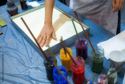 Artist Pressing Paper onto Water During Traditional Turkish Ebru Marbling Workshop