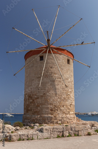 Historic Stone Windmill in Mandraki Harbor, Rhodes, Greece