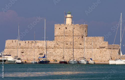 Fort of Saint Nicholas and Lighthouse in Mandraki Harbor, Rhodes, Greece