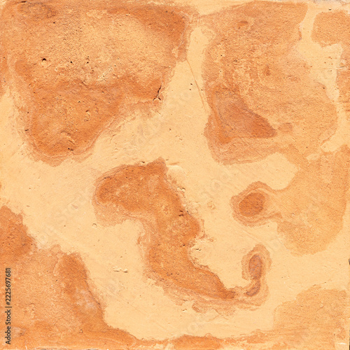 Adobe mud plaster creating an abstract textured background with unevenbackground patterns