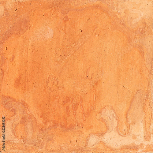 Adobe mud plaster creating an abstract textured background with unevenbackground patterns