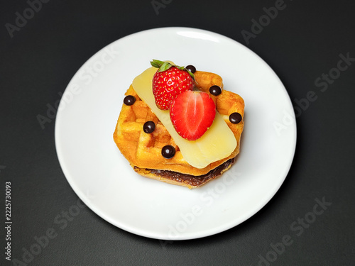 Delicious Belgian Waffle Topped with Fresh Organic Strawberries and Sliced Cheese on White Plate, Gourmet Breakfast Dessert Pastry for Brunch Cafe Menu, Healthy Sweet Savory Homemade Food Photography