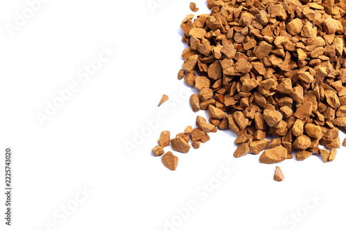 Instant coffee granules piles isolated on white background.