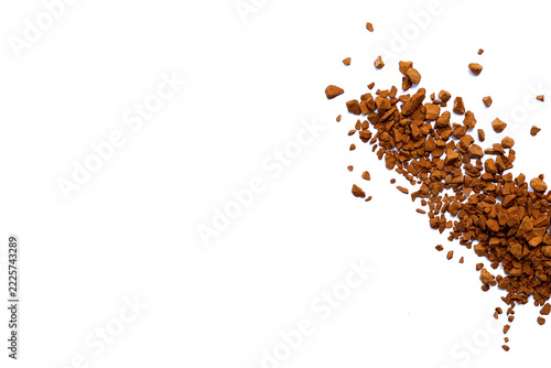 Instant coffee granules piles isolated on white background.