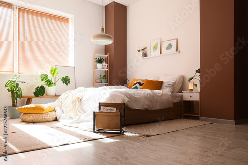 Interior design and home comfort, cozy bedroom with modern furniture and hous...