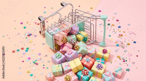 Miniature shopping cart with small gift boxes on colorful background
