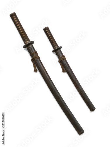 Pair of sheathed Japanese samurai swords isolated on white
