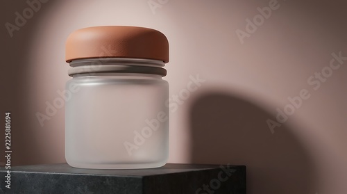 A minimalist spill proof container made of frosted glass with a terracotta lid placed on a dark stone display base