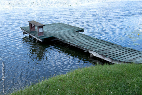 Beautiful forest and lake with a wooden board. Stock Photo of fishing pier