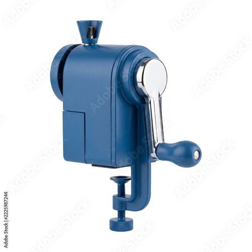 Blue metal manual desk pencil sharpener with a hand crank handle, a cone holder and a table clamp thumb screw, isolated on transparent background
