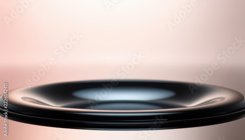 Abstract futuristic black glossy floating platform with soft pink beige background