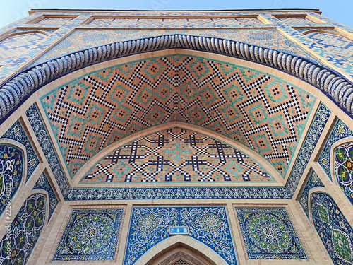 Ornate tilework facade of Ulugh Beg Observatory in Samarkand featuring geometric and floral mosaic patterns. Ideal for travel publications, cultural heritage materials, and architectural design.
