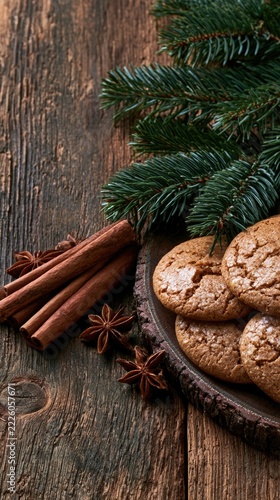 Christmas spiced cookies with cinnamon and star anise on rustic wood