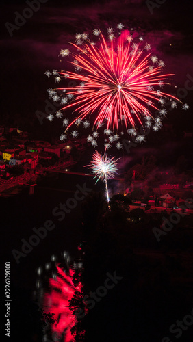 Red Fireworks Above Douelle With Reflections In The Lot River