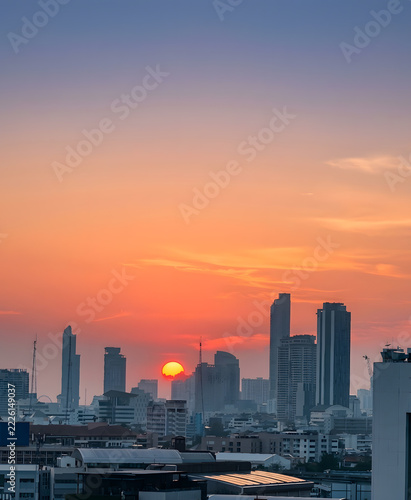 Golden Sunset Over City Skyline with High-Rise Buildings