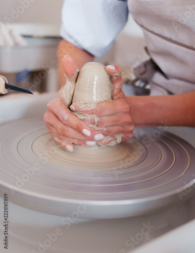 Pottery Making Process. Female Potter Working with Clay in Ceramic Workshop