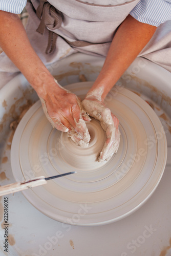 Pottery Making Process. Female Potter Working with Clay in Ceramic Workshop