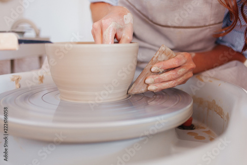 Pottery Making Process. Female Potter Working with Clay in Ceramic Workshop